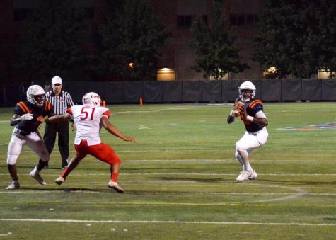 Senior Quarterback Jeremy Hunt drops back to throw a pass 