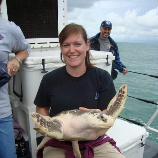 Kelsey Kaiser holding a sea turtle
