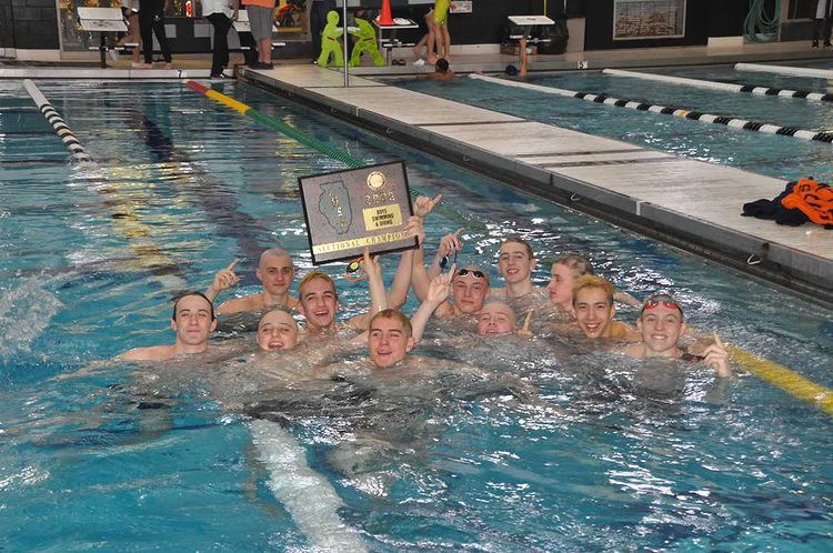 Members of the Boys Swim and Dive team celebrate their sectional win in February 2020