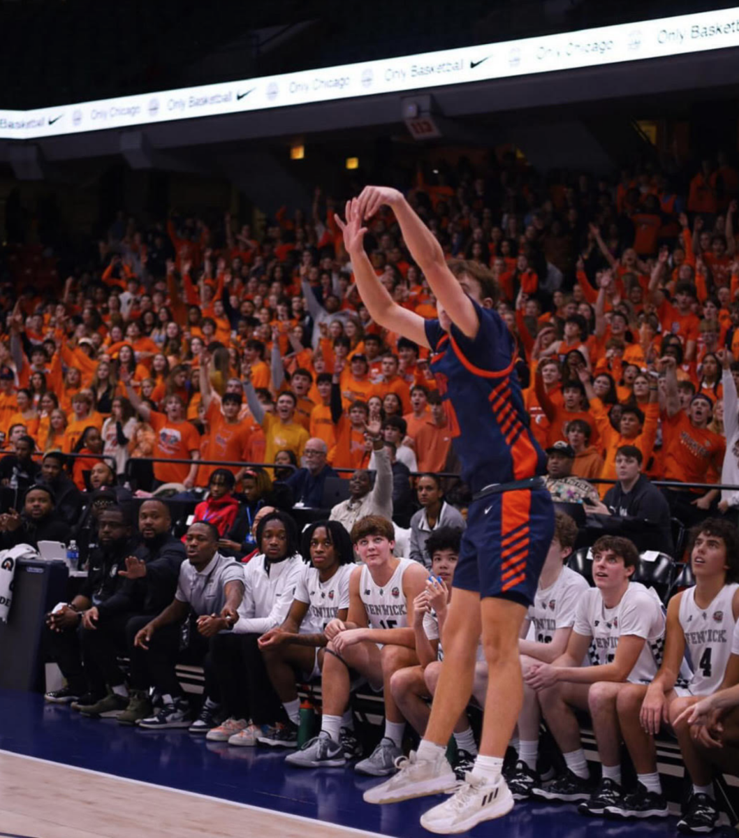 John Lambe shoots a 3-pointer.