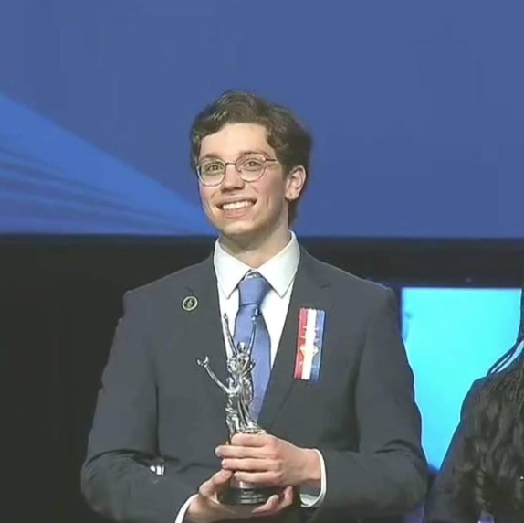 Medina being awarded his trophy for his placement in Nationals