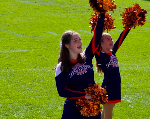 Leah Scholvin cheering alongside her teammate Fiona Macmillan.