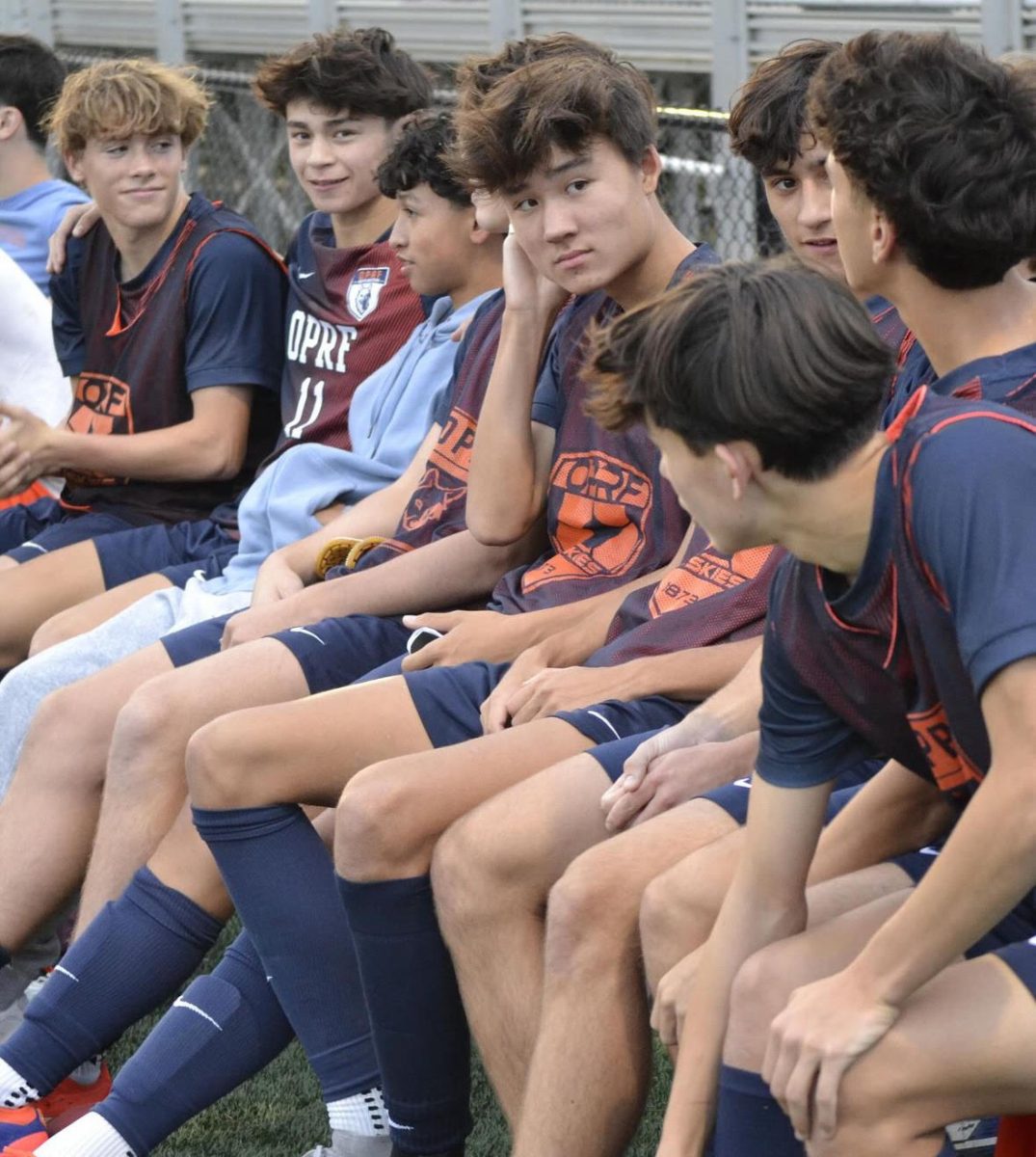 Team sitting together on the bench.