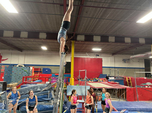  Sophomore Zoe Schwartz practing on the bars at Tri-Star Gymnastics