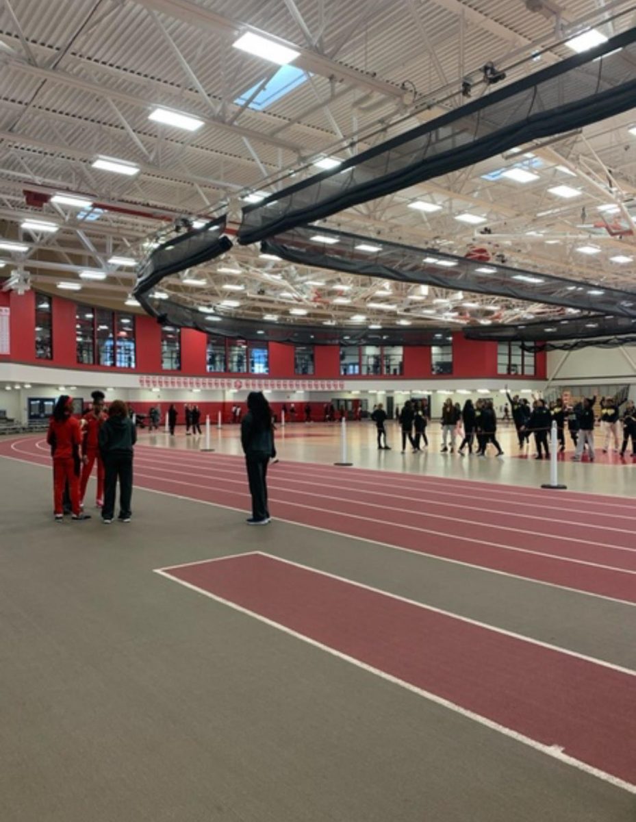 OPRF girl’s track team warming up before a their Homewood Flossmoor meet.