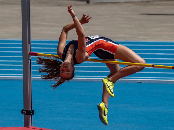 Brauc clearing the bar in her high jump event during State last season.