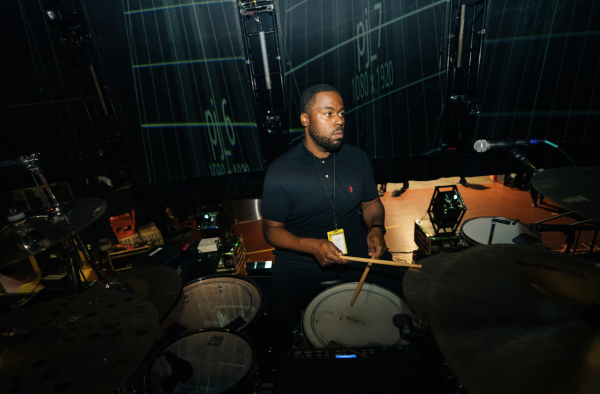 Drummer Cardell Whitley, who also works as an OPRF campus safety officer,  on the road with R&B artist Maxwell