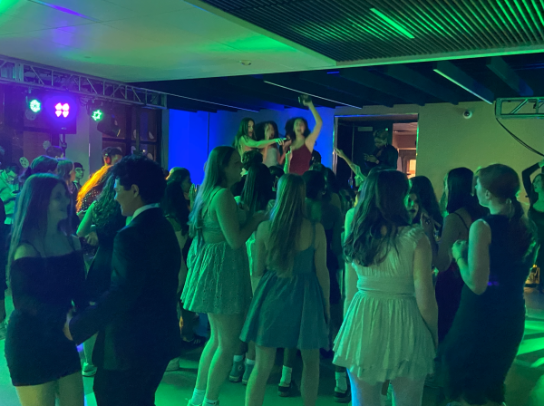 Seniors Sonia Lavery, Josie Badrinath and Natalia Joseph on stage at the Winter Formal