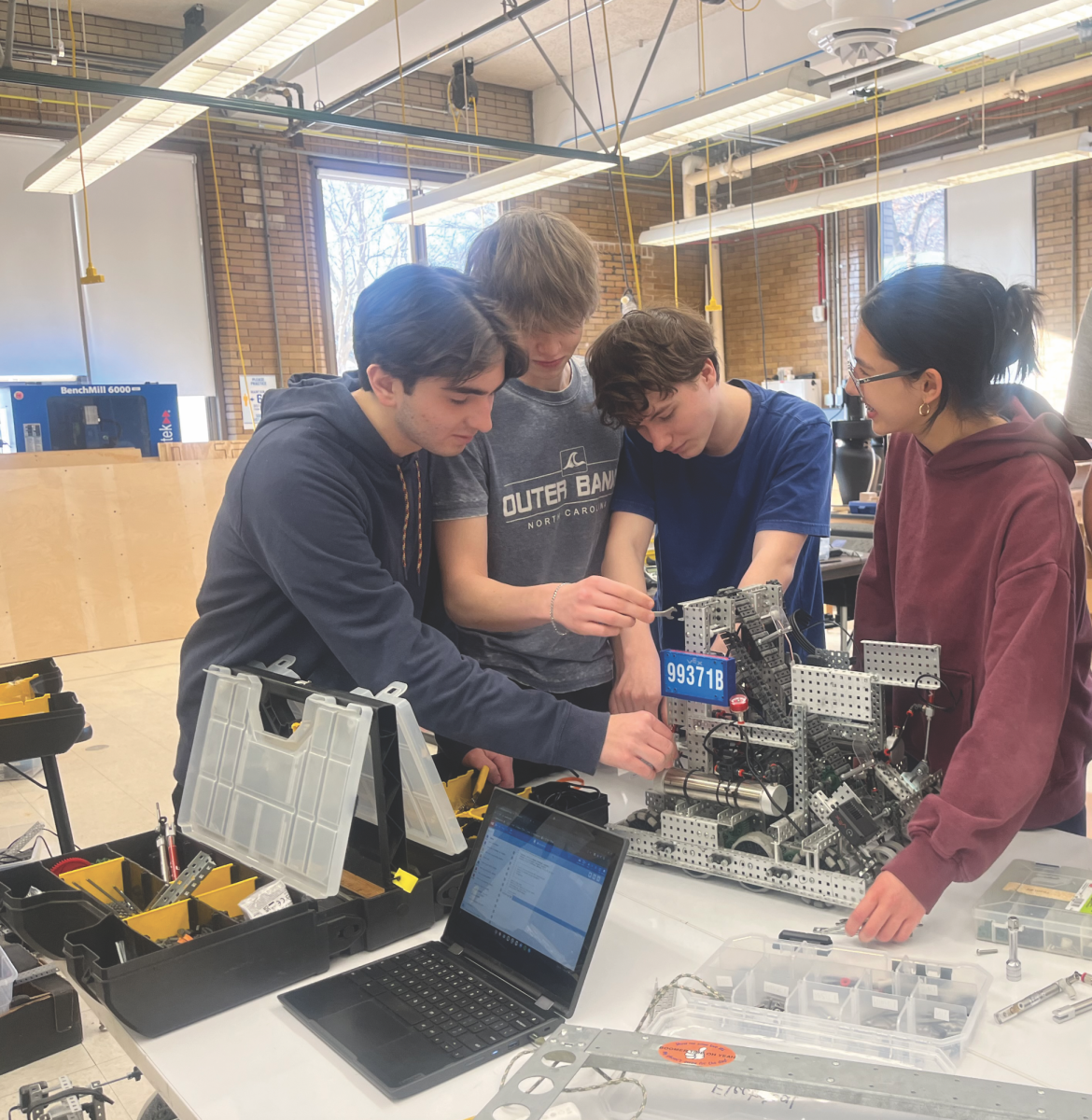 Robotics members working on their robot.