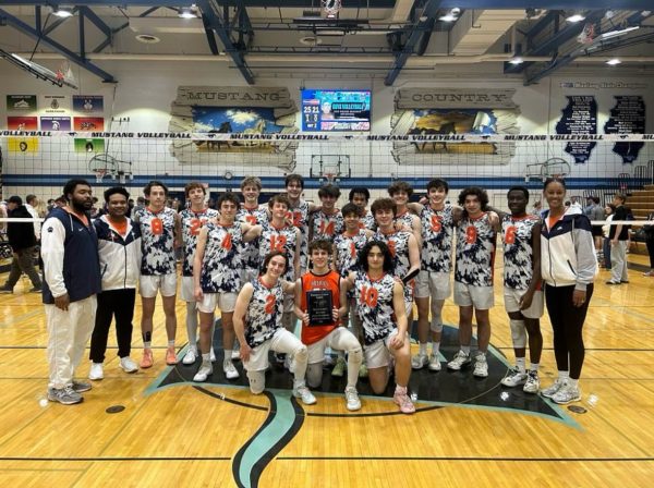 Huskies celebrating after winning second place at the Downers Grove South invite