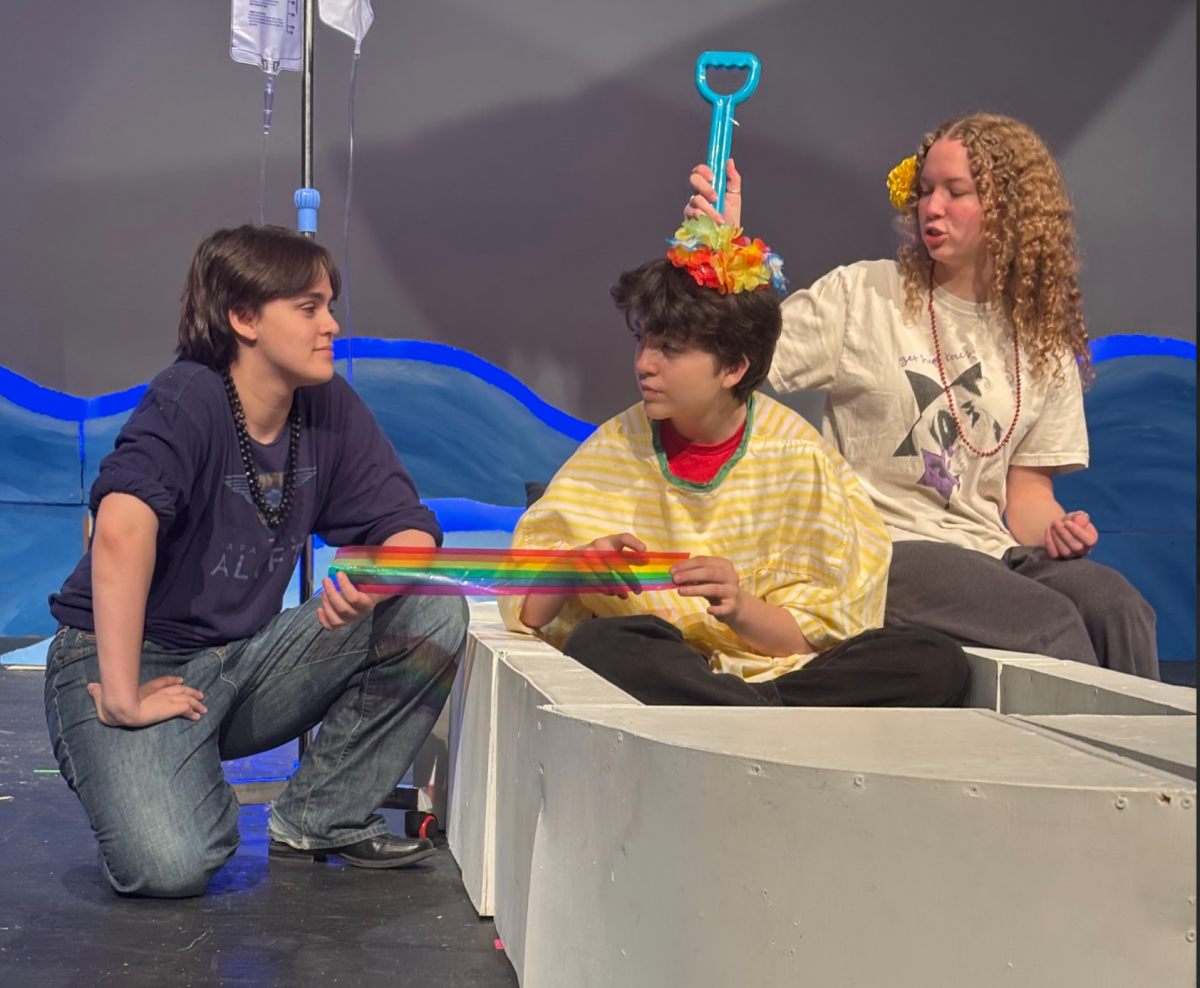 Rowan Neville, Theo Harris and Tessa Pruden reherasing for The Yellow Boat.