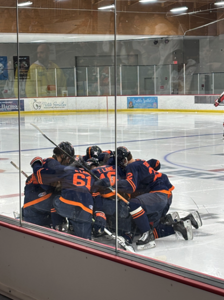 OPRF hockey players huddled