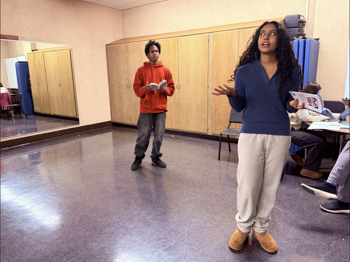 Ajani Dosunnmu (left) and Vivian Porrez (right) rehearsing “1984”