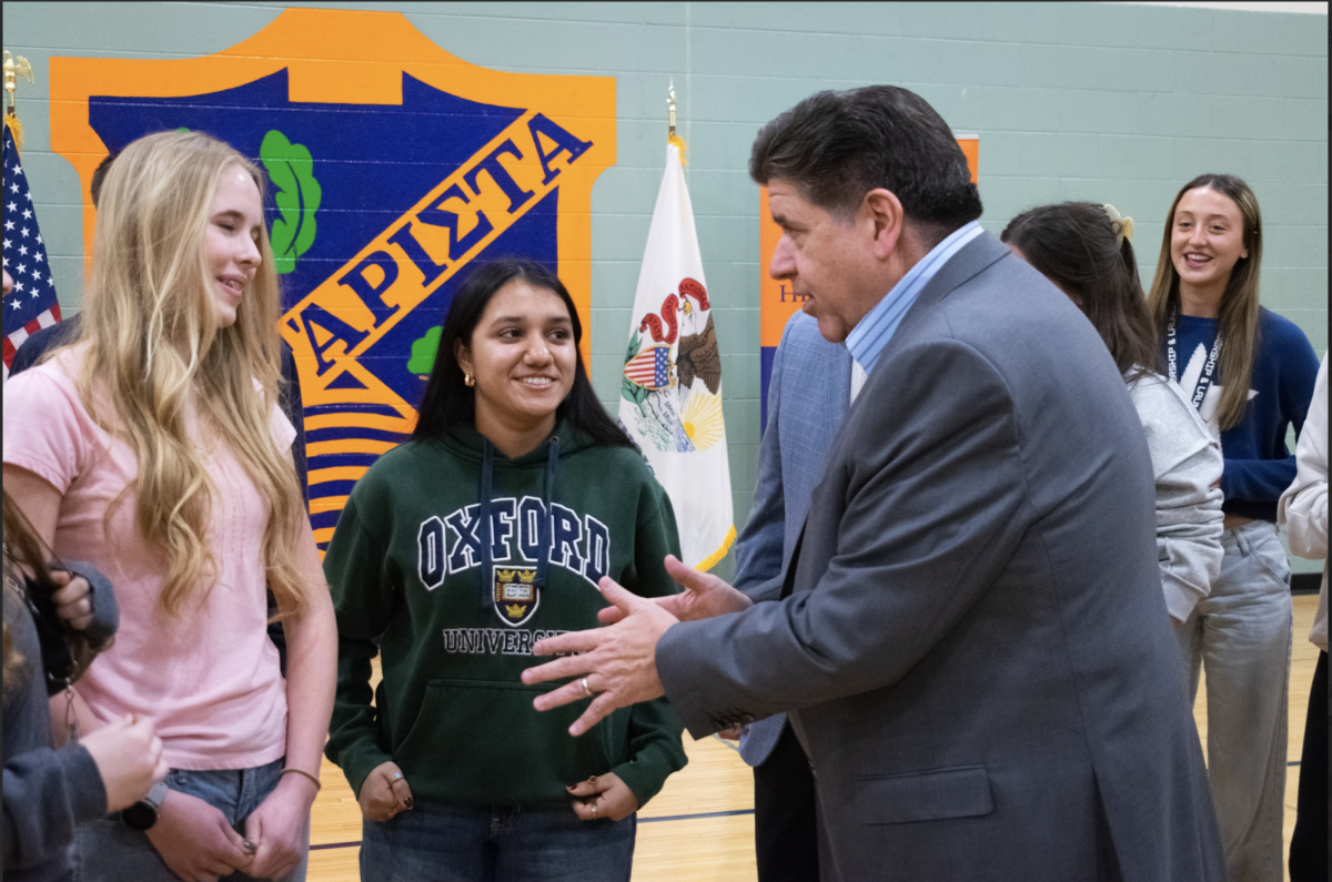 Gov. Pritzker speaking with students who attended the press conference 