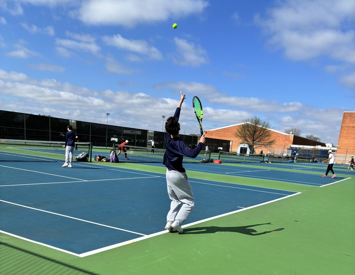 The boys tennis team on the court April 18