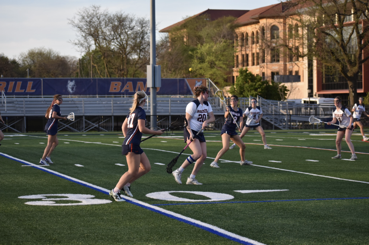 Tess Cronin cradles the ball in the opponent's half. 